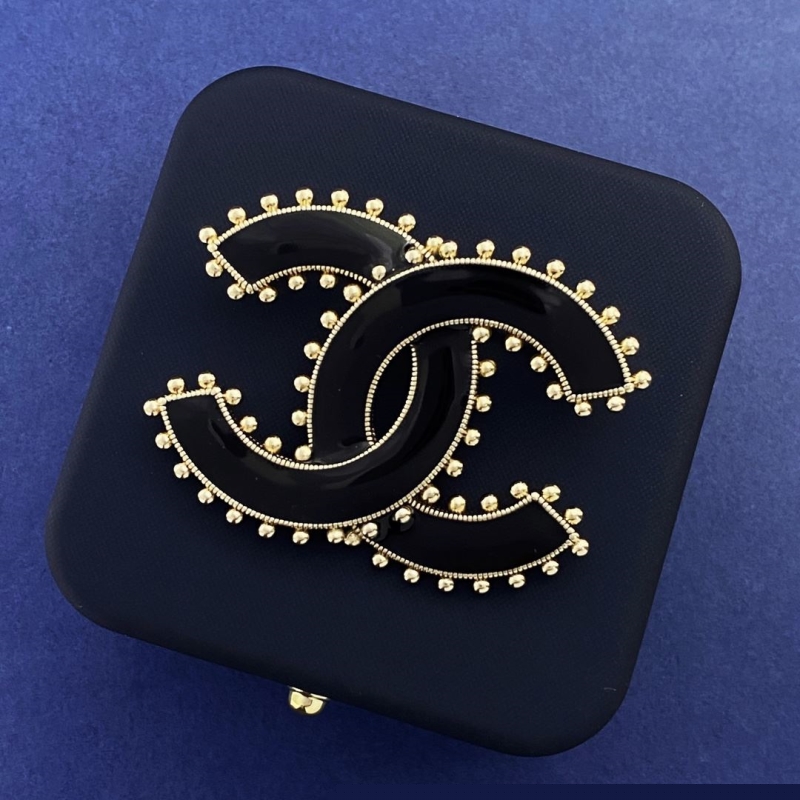 Ch*el brooches